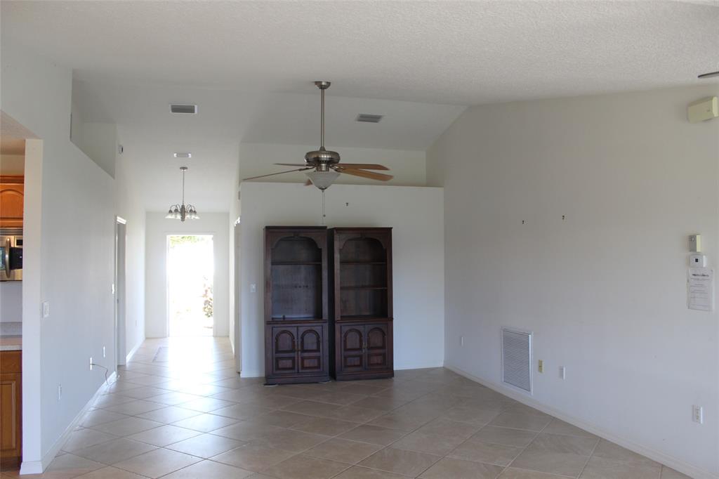 2422 Southeast 33rd Street Okeechobee, FL 34974 - Photo 15 of 32 a view of an empty room with a fireplace