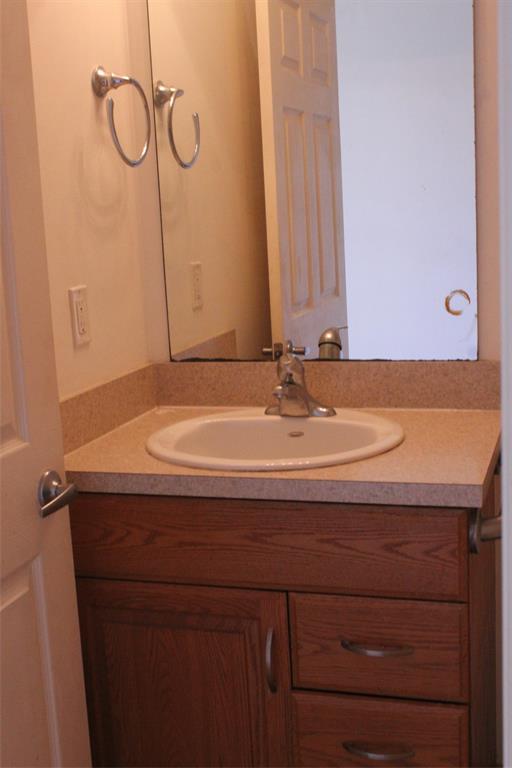 2422 Southeast 33rd Street Okeechobee, FL 34974 - Photo 16 of 32 a bathroom with a sink and a mirror