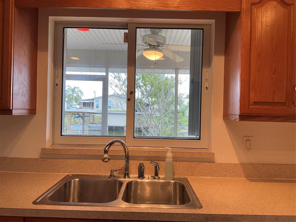 2422 Southeast 33rd Street Okeechobee, FL 34974 - Photo 24 of 32 a sink window and glass door