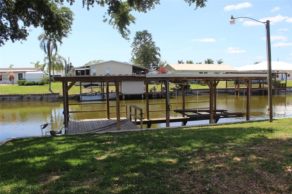 2422 Southeast 33rd Street Okeechobee, FL 34974 - Photo 4 of 32 a view of a lake with a sitting area
