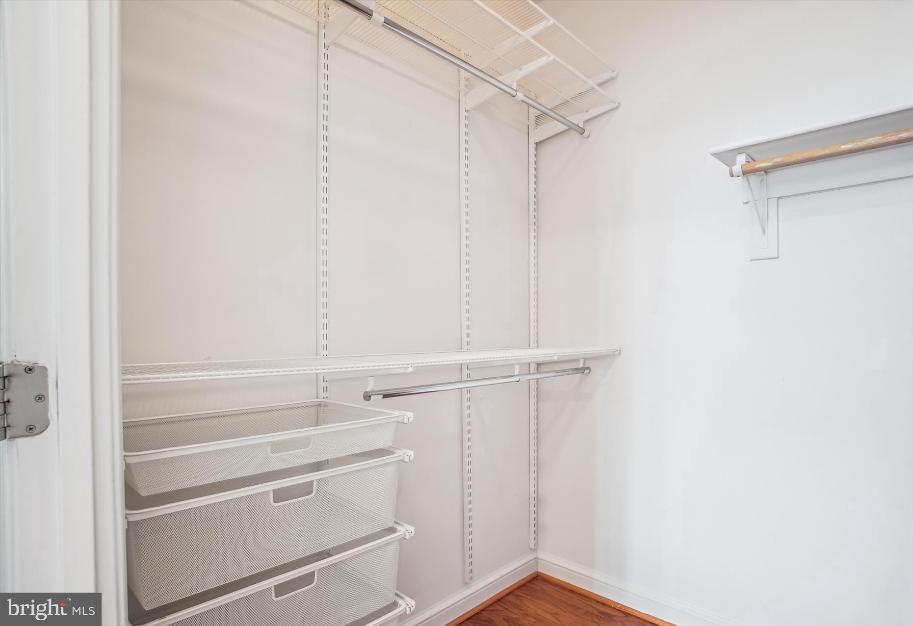 11990 Market Street, Unit 805 Reston, VA 20190 - Photo 27 of 53 a view of walk in closet with empty racks