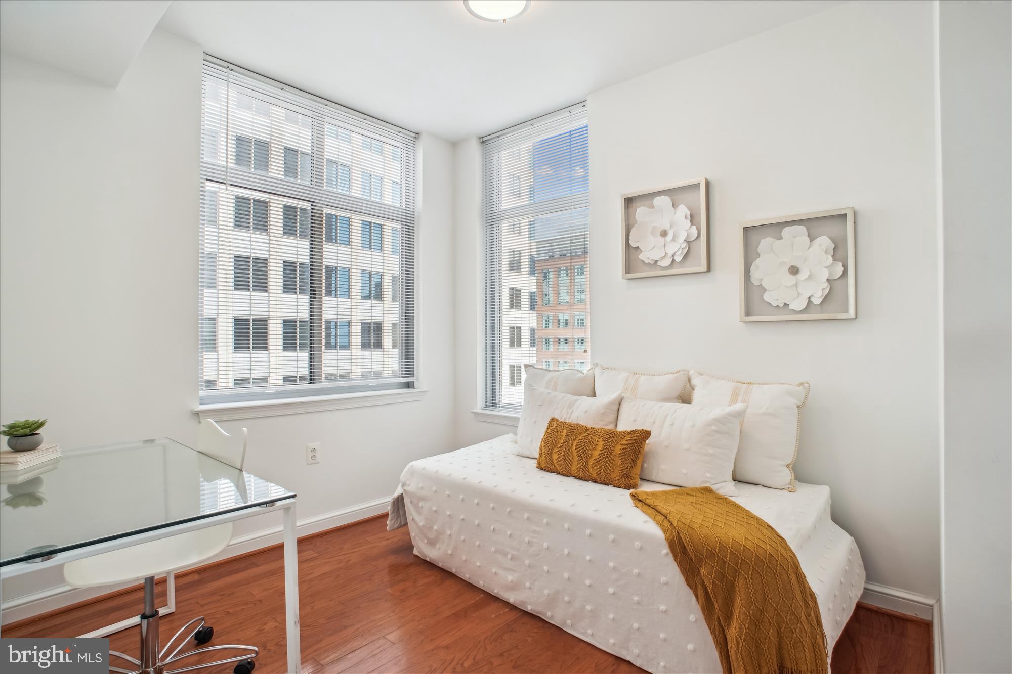 11990 Market Street, Unit 805 Reston, VA 20190 - Photo 28 of 53 a bed room with a bed and a window