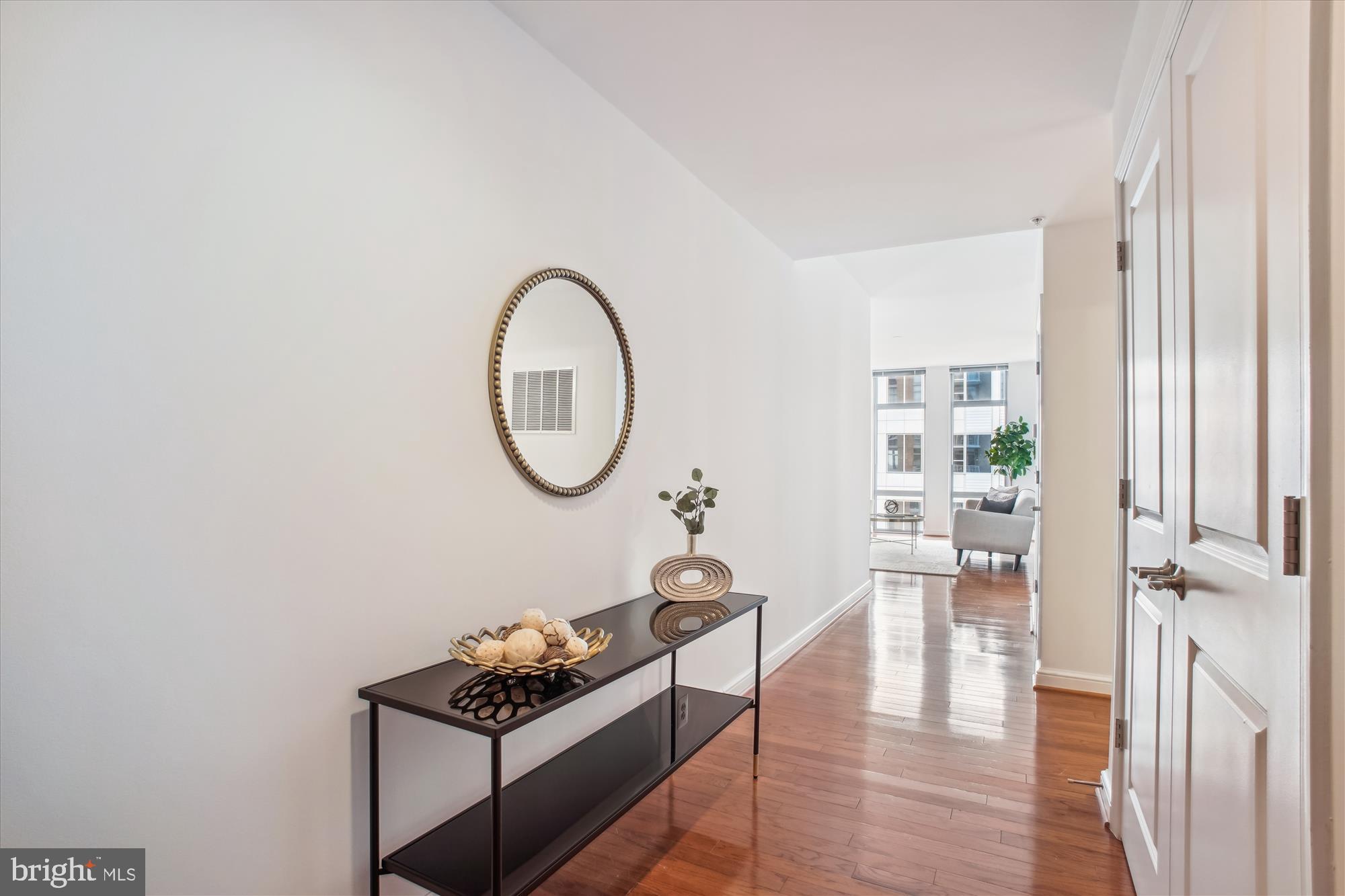 11990 Market Street, Unit 805 Reston, VA 20190 - Photo 4 of 53 a view of a livingroom with furniture and a window