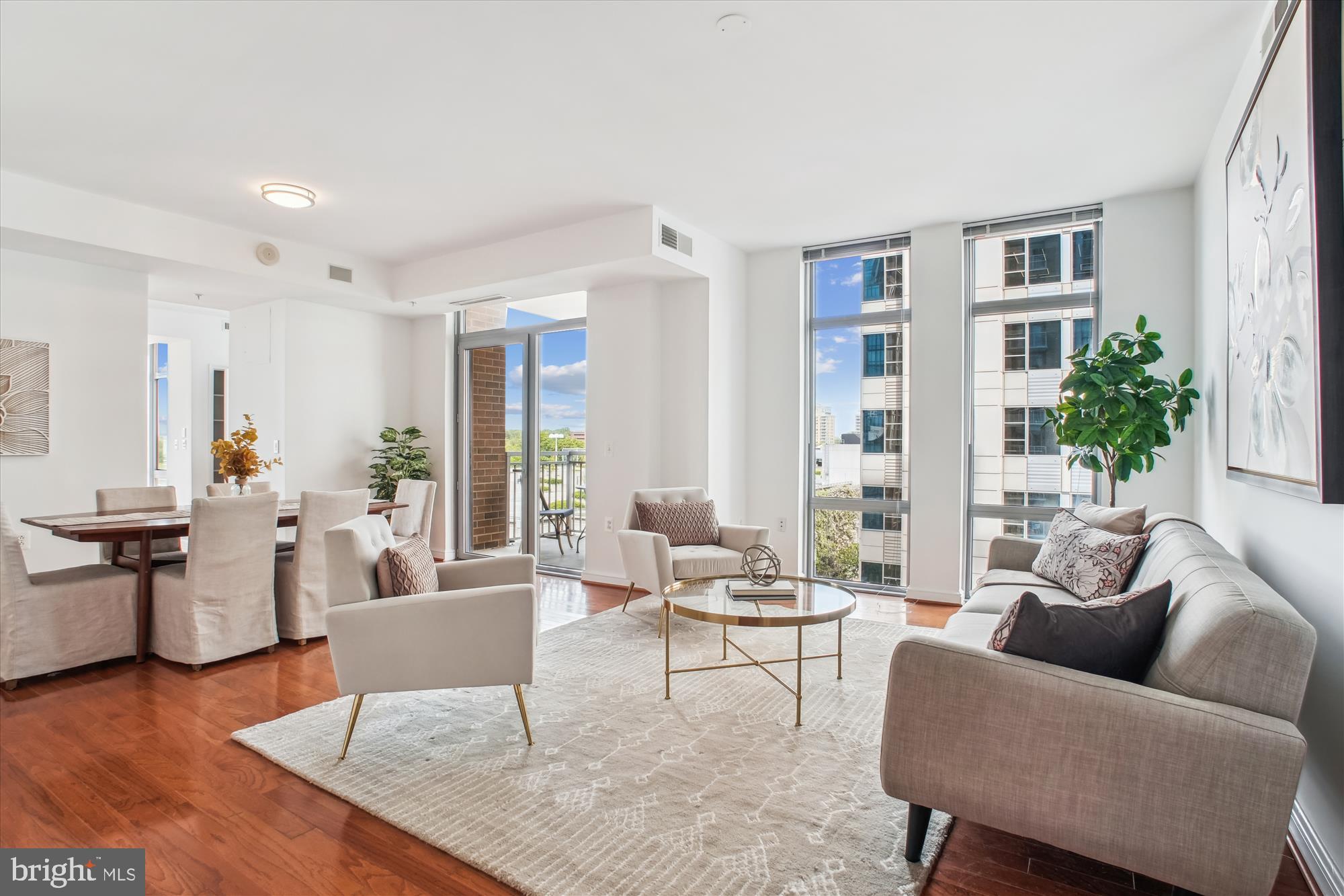 11990 Market Street, Unit 805 Reston, VA 20190 - Photo 5 of 53 a living room with furniture and wooden floor