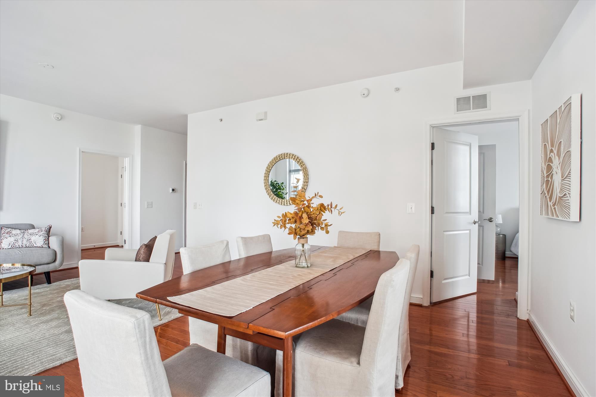 11990 Market Street, Unit 805 Reston, VA 20190 - Photo 8 of 53 a dining room with furniture and wooden floor