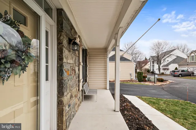 a kitchen with granite countertop stainless steel appliances a sink a stove and cabinets