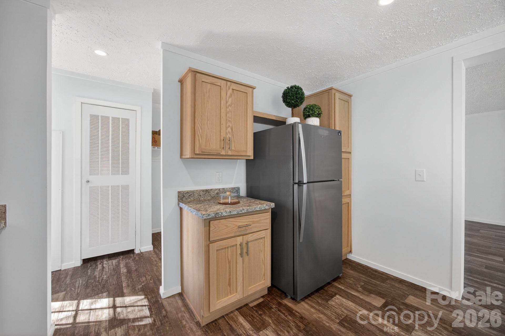 1395 Safrit Road Salisbury, NC 28146 - Photo 11 of 37 a kitchen with a refrigerator a stove and a microwave
