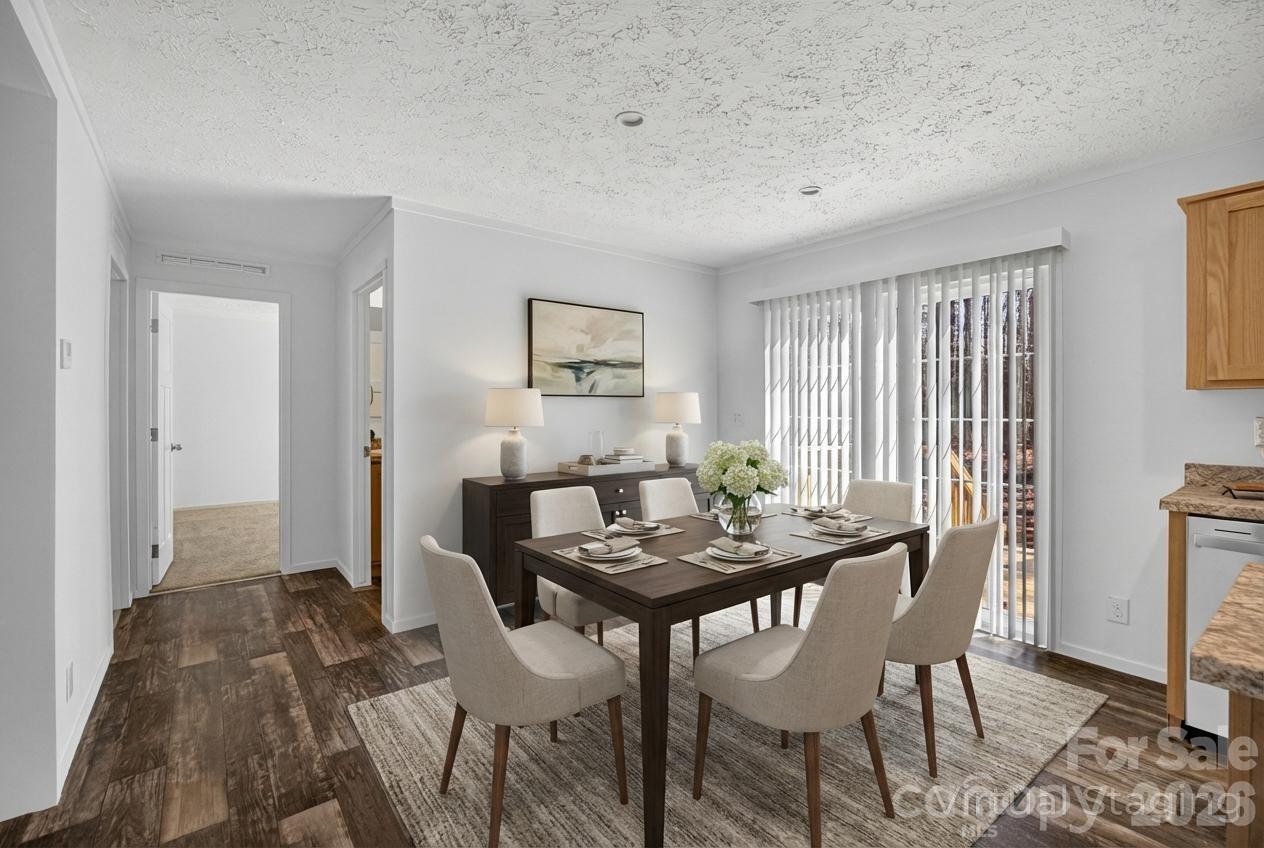 1395 Safrit Road Salisbury, NC 28146 - Photo 14 of 37 a view of a dining room with furniture and wooden floor