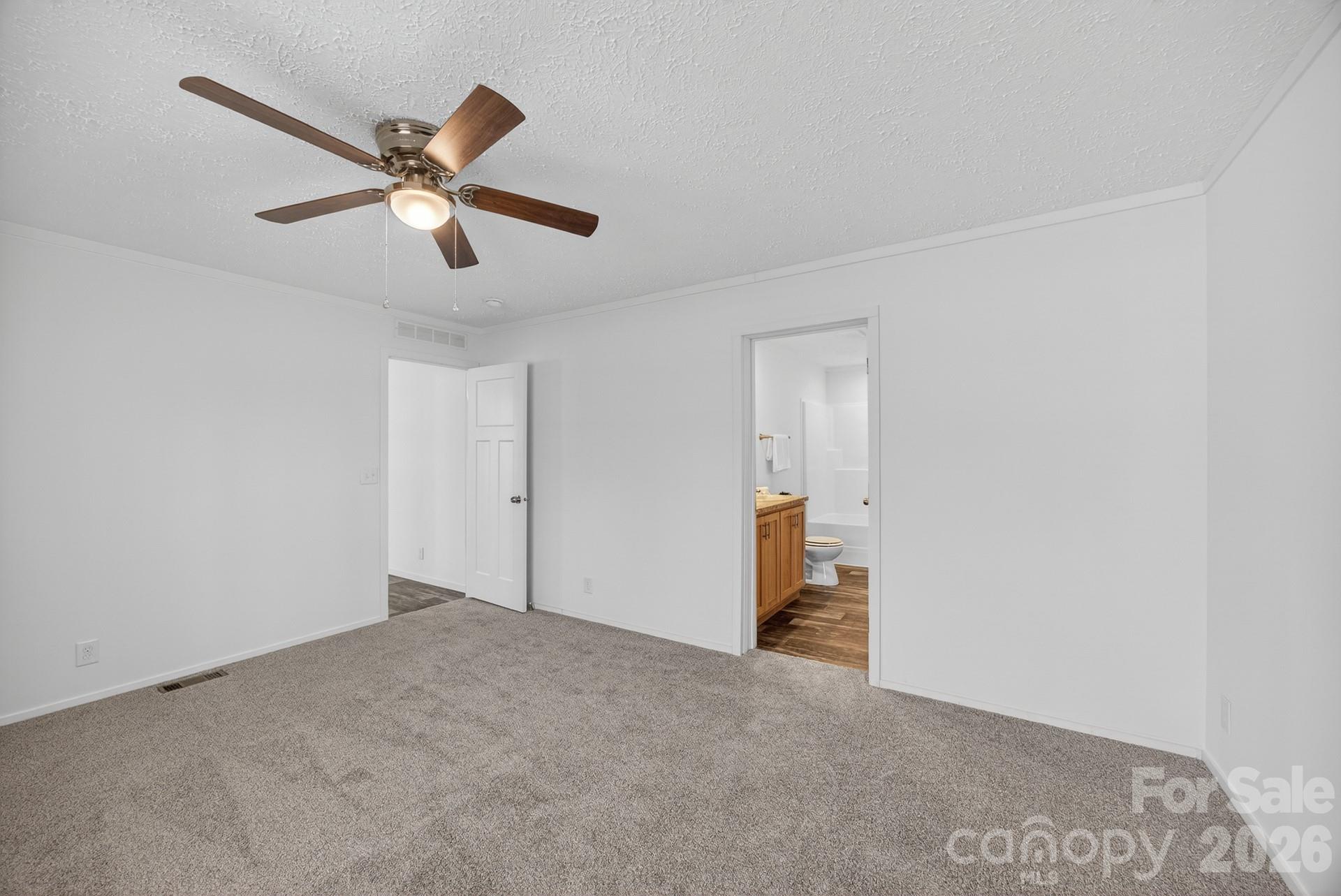 1395 Safrit Road Salisbury, NC 28146 - Photo 16 of 37 a view of an empty room and chandelier fan