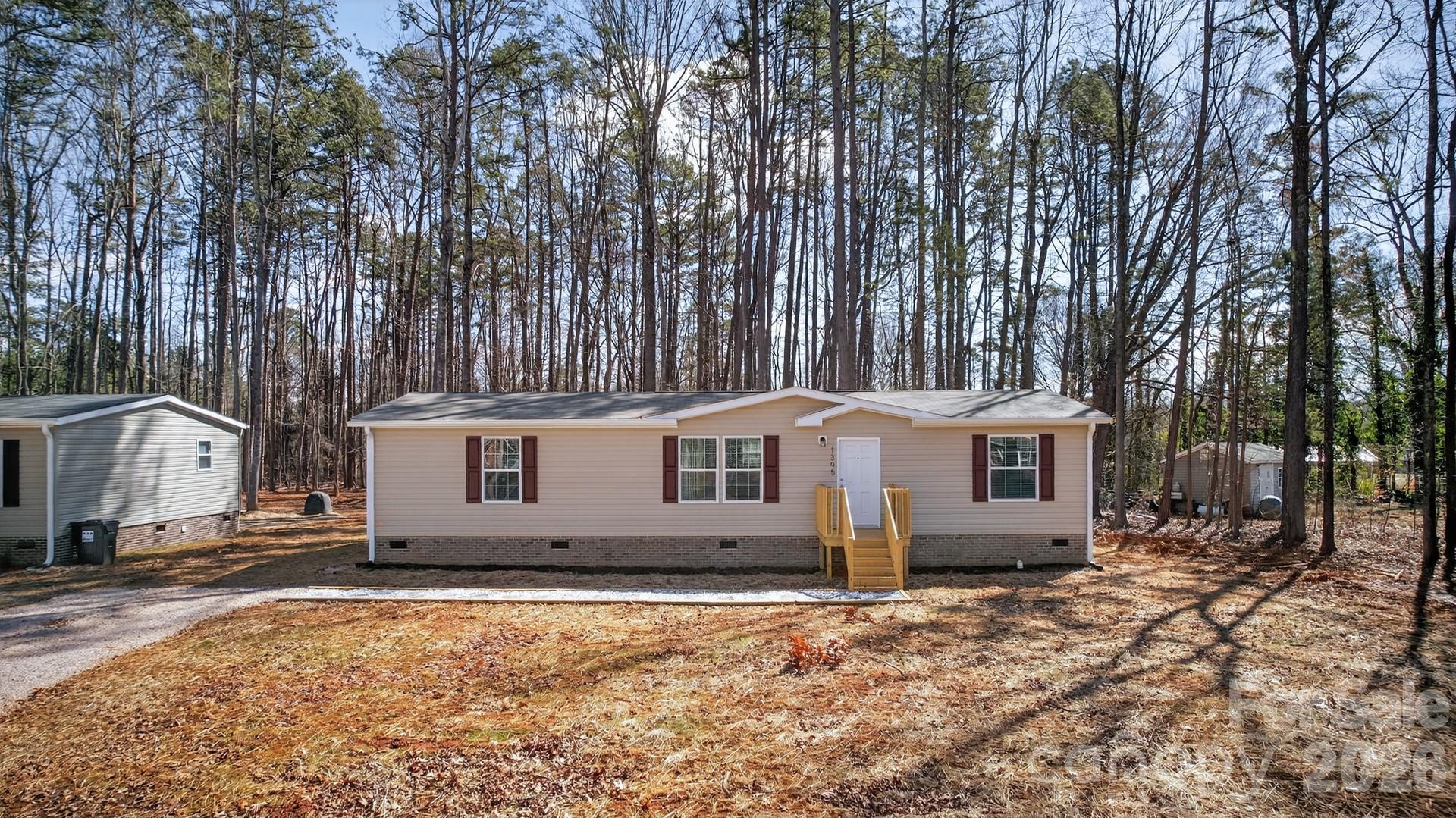1395 Safrit Road Salisbury, NC 28146 - Photo 2 of 37 front view of a house with a yard