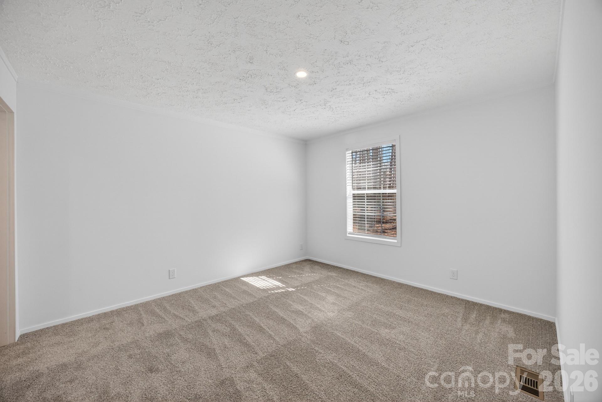 1395 Safrit Road Salisbury, NC 28146 - Photo 22 of 37 a view of an empty room with a window
