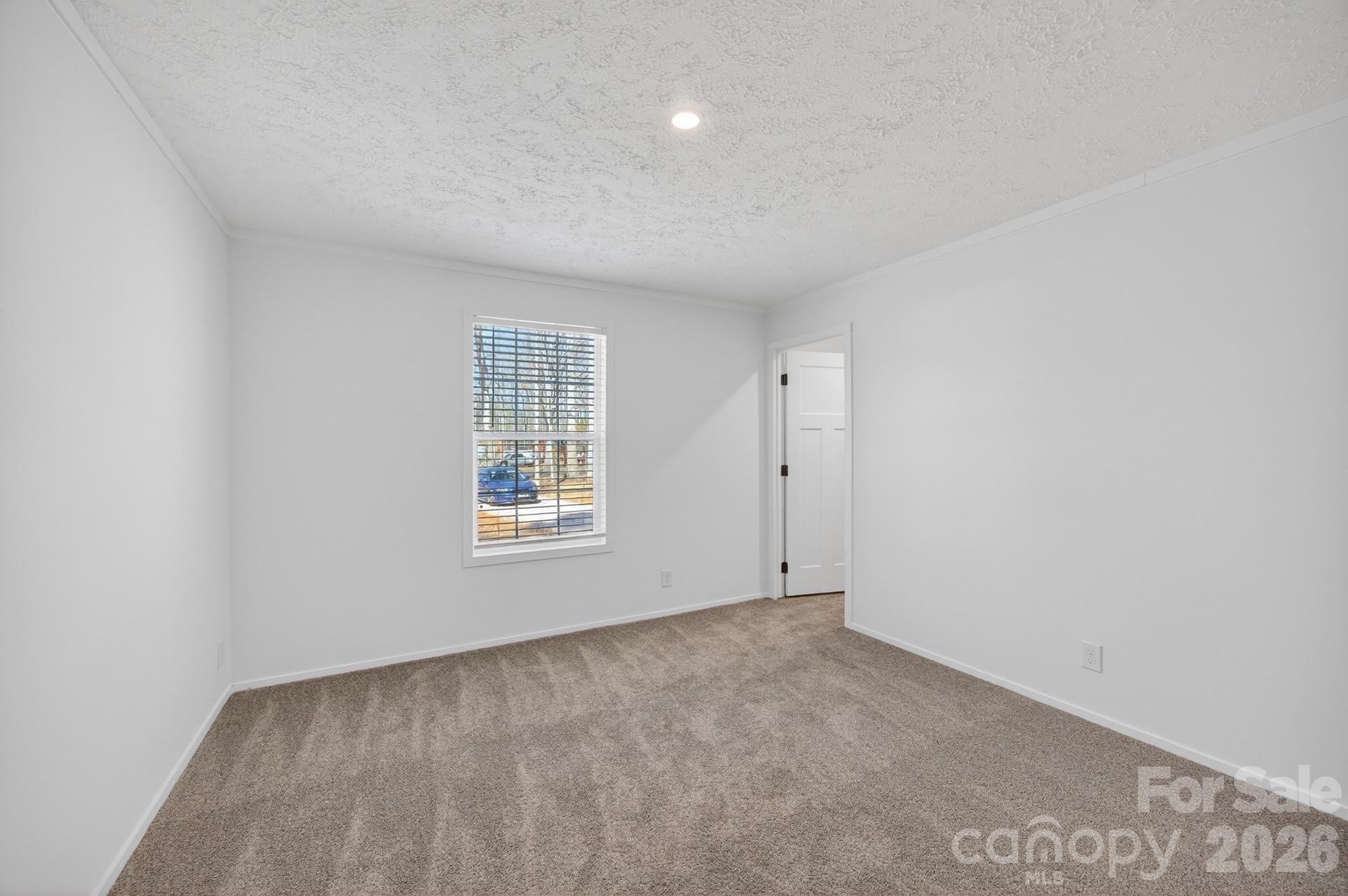 1395 Safrit Road Salisbury, NC 28146 - Photo 27 of 37 an empty room with a window