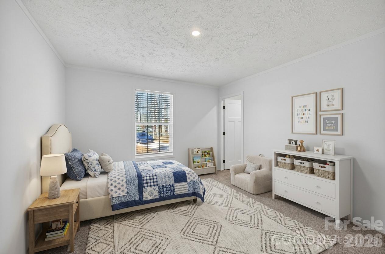 1395 Safrit Road Salisbury, NC 28146 - Photo 28 of 37 a spacious bedroom with a bed and furniture