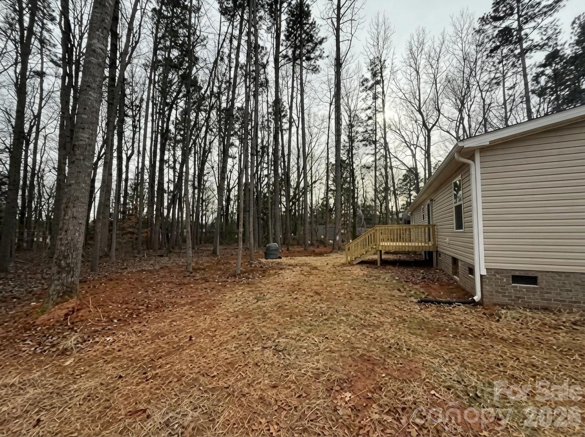 1395 Safrit Road Salisbury, NC 28146 - Photo 35 of 37 a backyard of a house with lots of green space