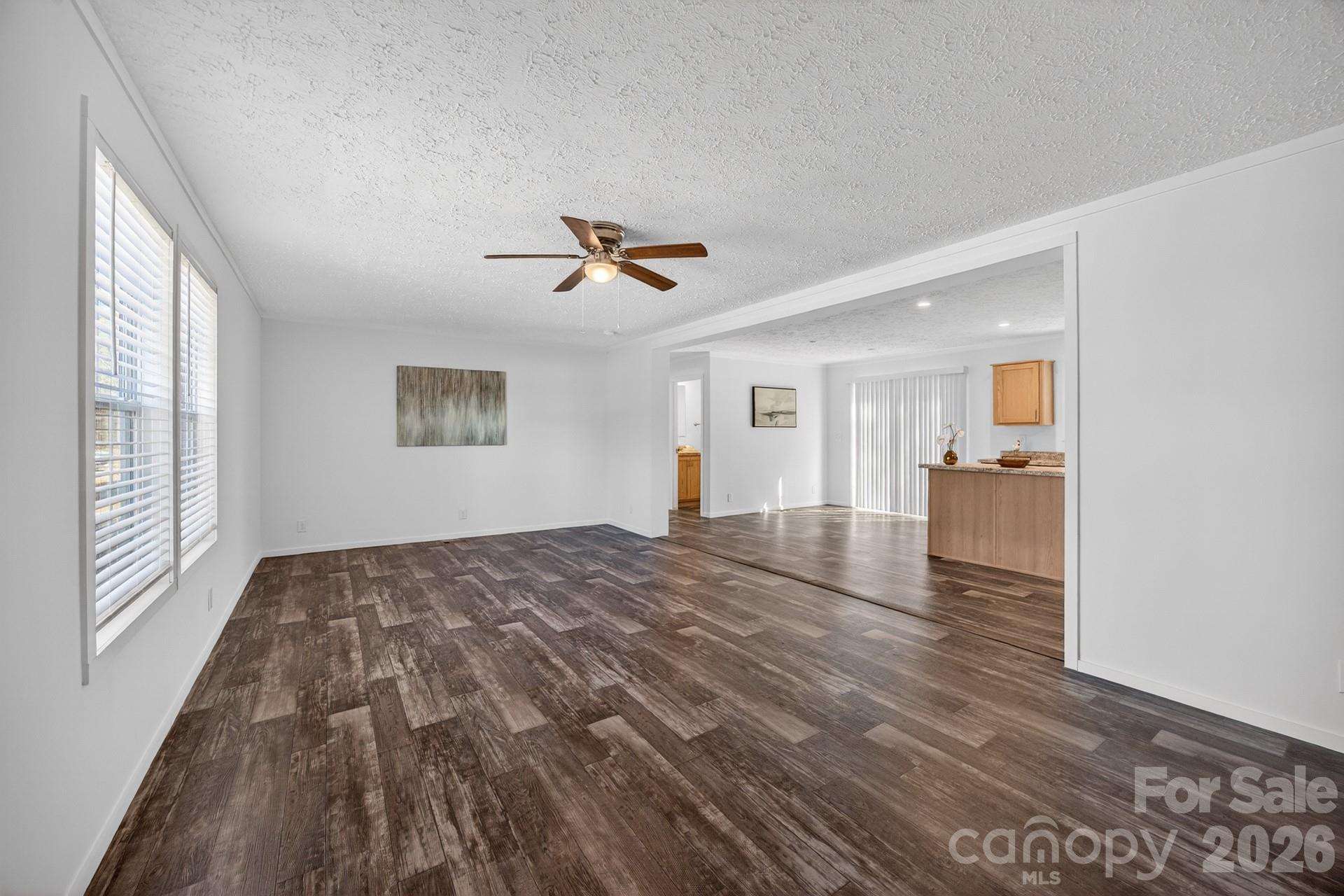1395 Safrit Road Salisbury, NC 28146 - Photo 6 of 37 a view of empty room with wooden floor and window