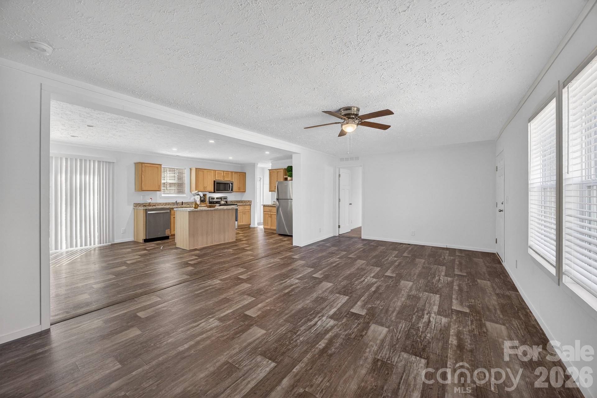 1395 Safrit Road Salisbury, NC 28146 - Photo 7 of 37 a view of a kitchen with furniture and wooden floor