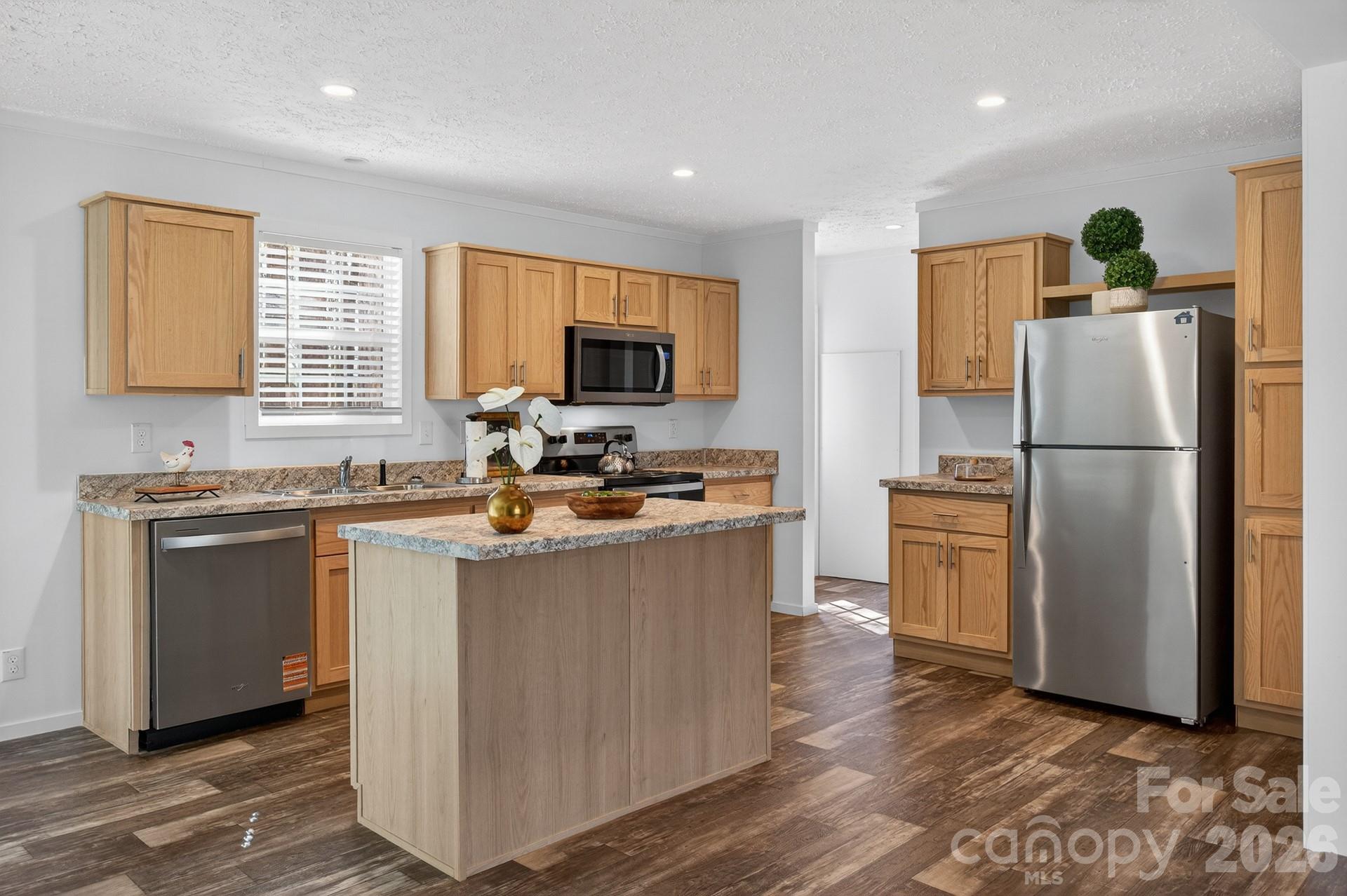 1395 Safrit Road Salisbury, NC 28146 - Photo 9 of 37 a kitchen with granite countertop a refrigerator stove and sink