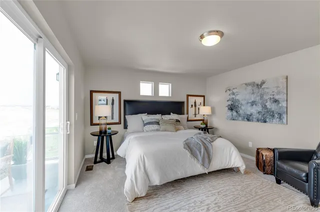 a bedroom with a bed and a view of bathroom