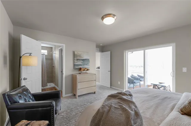 a bedroom with a bed and a couch