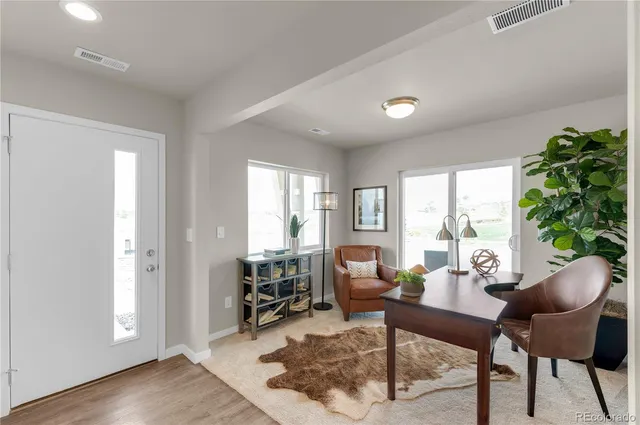a living room with furniture and a window