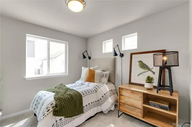 a bedroom with a bed and window