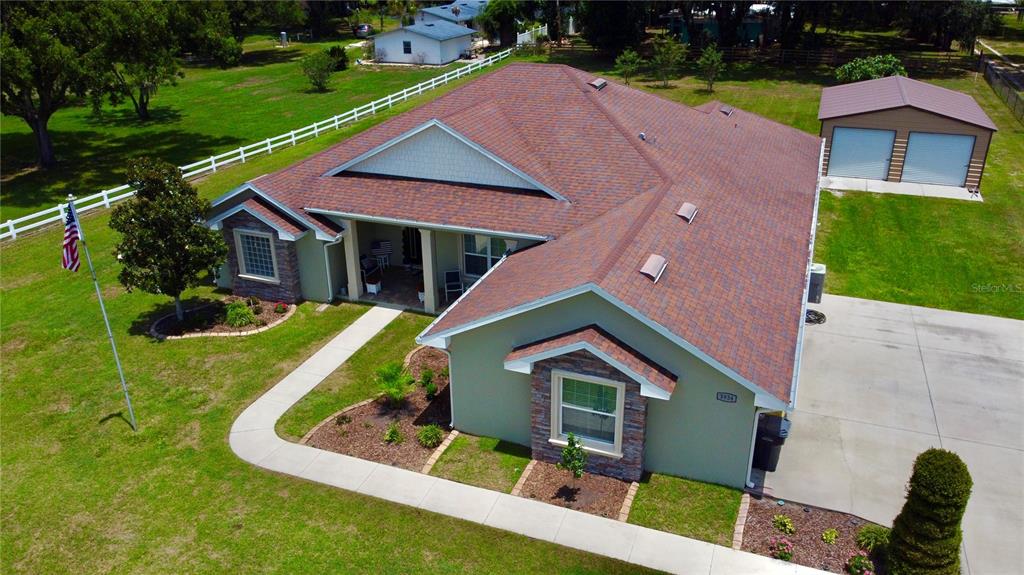 3934 Connersville Road Bartow, FL 33830 - Photo 66 of 81 a aerial view of a house with a yard patio and a garden