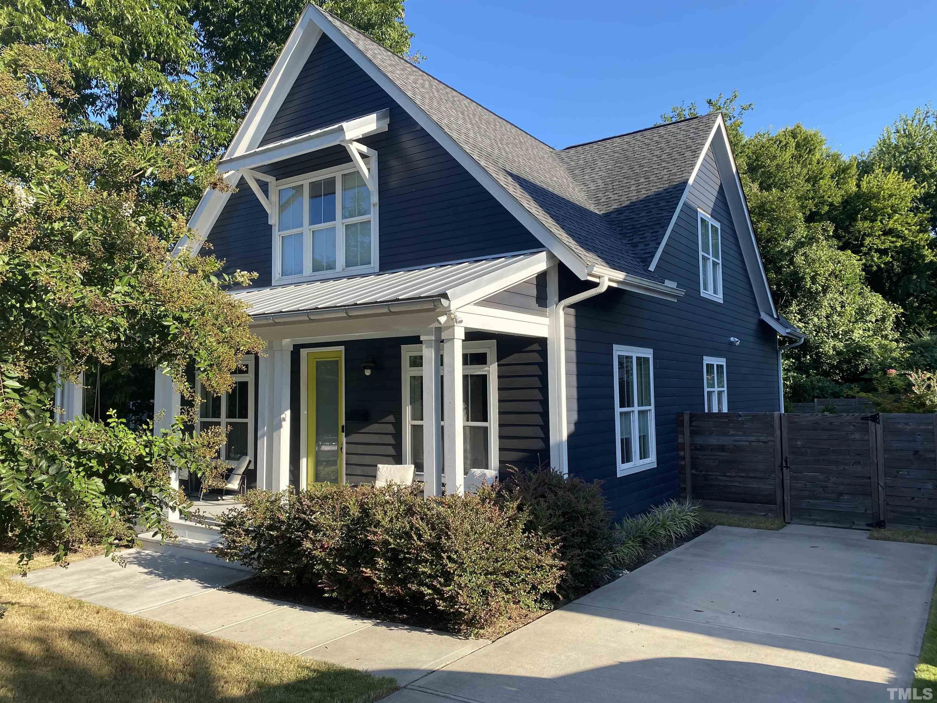 807 East Lane Street Raleigh, NC 27601 - Photo 1 of 4 a front view of a house with garden