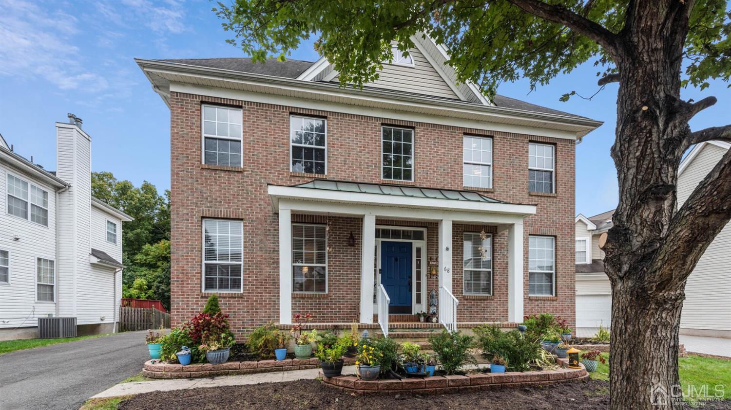 68 Timber Ridge Road North Brunswick, NJ 08902 - Photo 1 of 37 a front view of a house with a yard