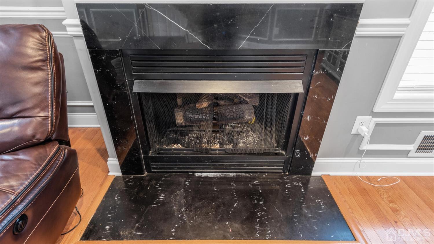 68 Timber Ridge Road North Brunswick, NJ 08902 - Photo 12 of 37 a view of fireplace and wooden floor
