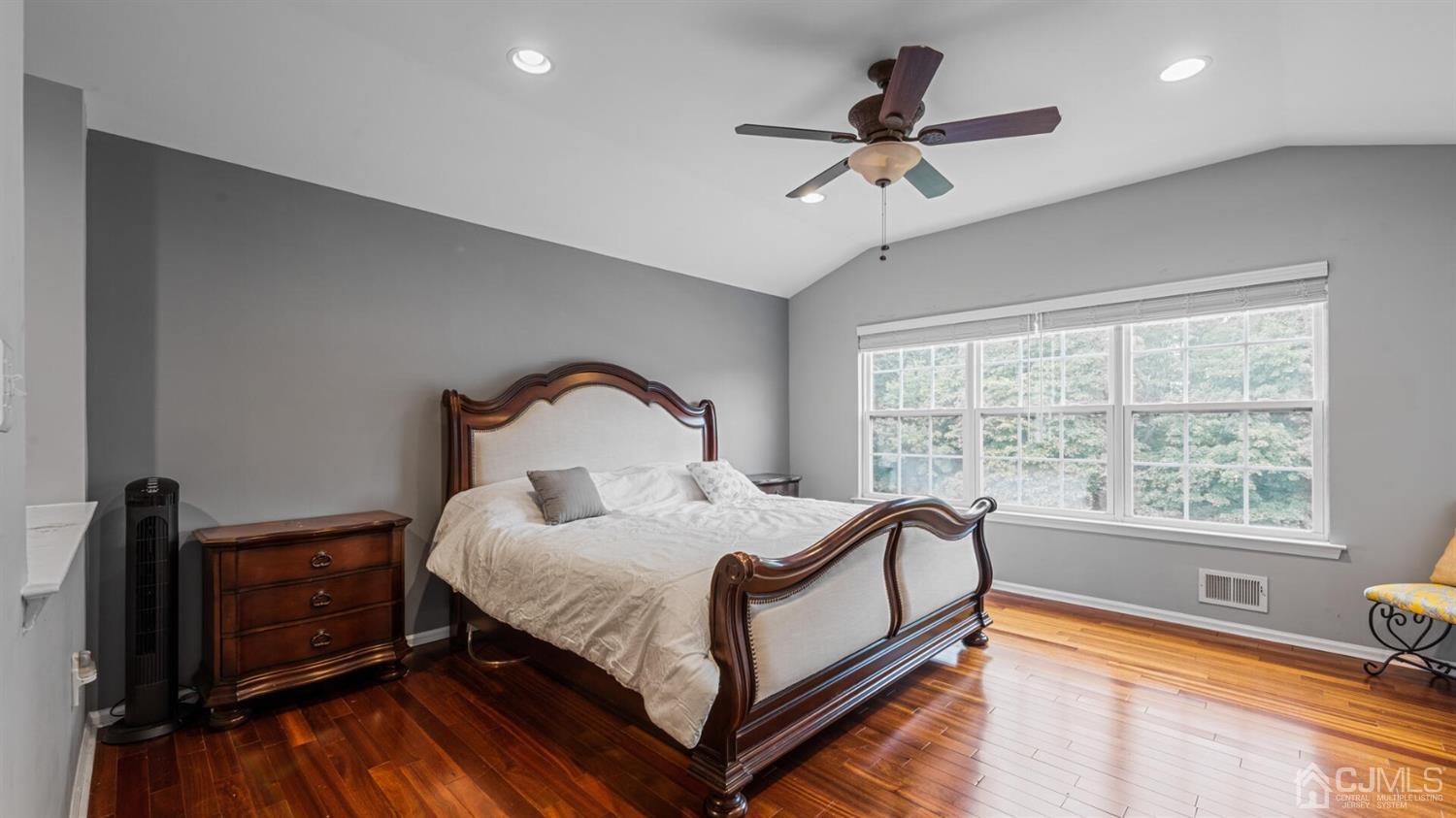 68 Timber Ridge Road North Brunswick, NJ 08902 - Photo 17 of 37 a bedroom with a bed and a tv on the dresser
