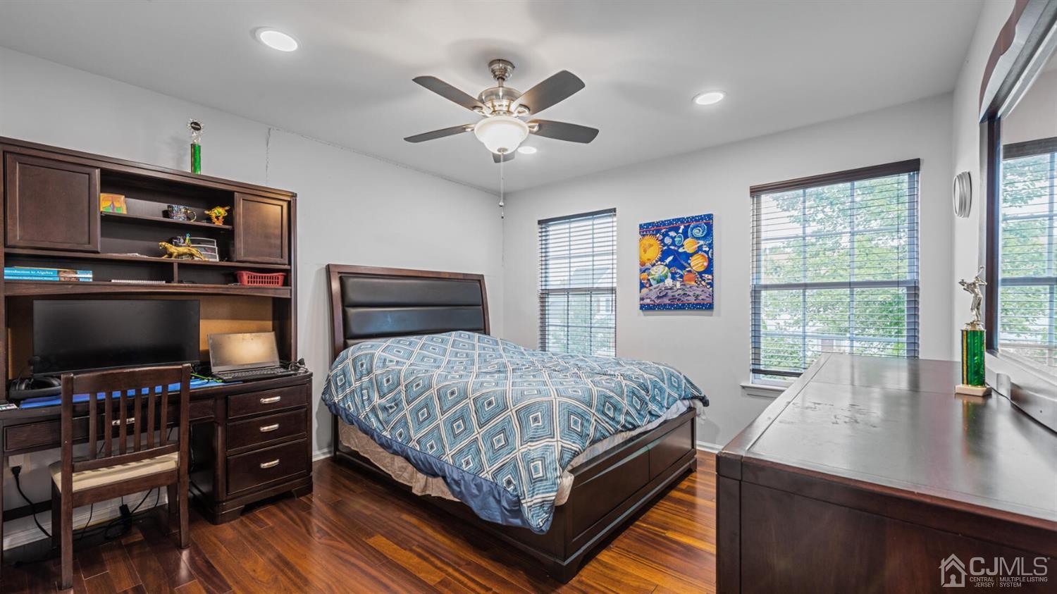 68 Timber Ridge Road North Brunswick, NJ 08902 - Photo 22 of 37 a bedroom with a bed and a flat screen tv