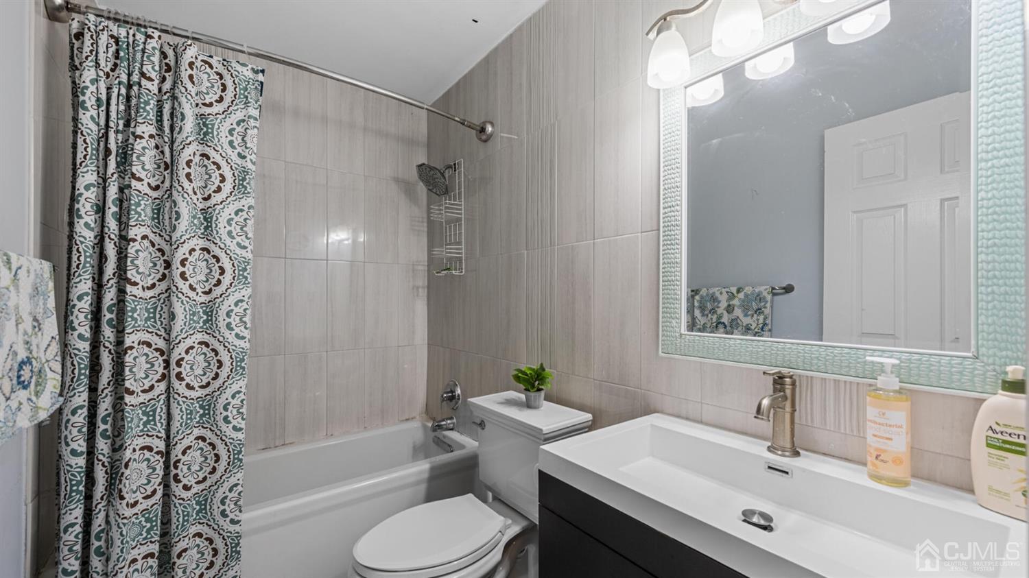 68 Timber Ridge Road North Brunswick, NJ 08902 - Photo 23 of 37 a bathroom with a sink toilet and shower