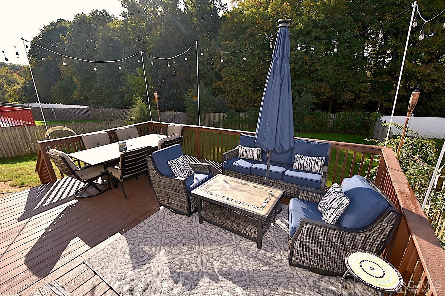 68 Timber Ridge Road North Brunswick, NJ 08902 - Photo 33 of 37 a view of a patio with a dining table and chairs