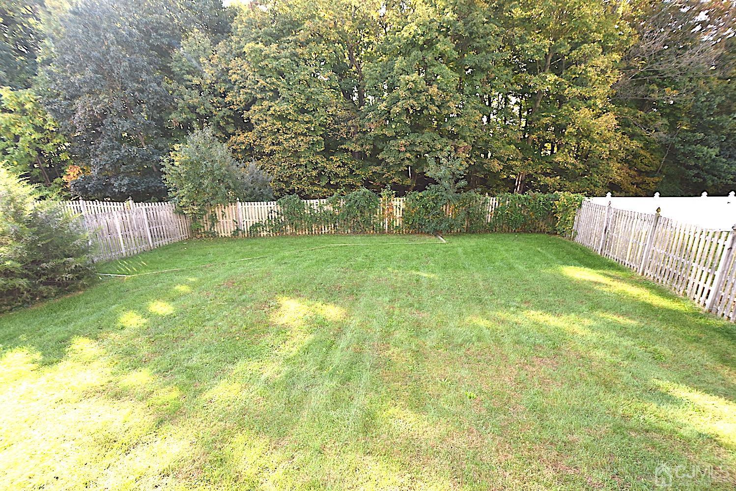 68 Timber Ridge Road North Brunswick, NJ 08902 - Photo 34 of 37 a view of a garden with a bench