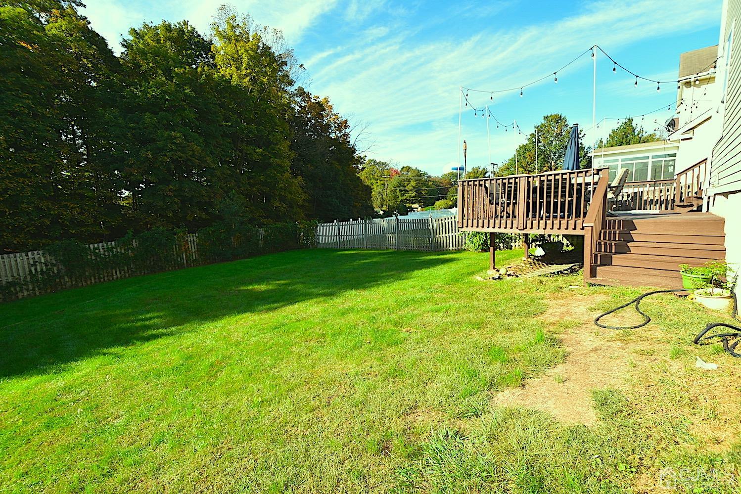 68 Timber Ridge Road North Brunswick, NJ 08902 - Photo 36 of 37 a view of a chair and table in the garden