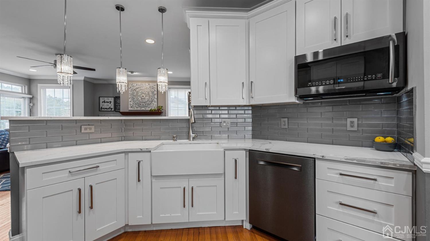 68 Timber Ridge Road North Brunswick, NJ 08902 - Photo 7 of 37 a kitchen with white cabinets stainless steel appliances and sink