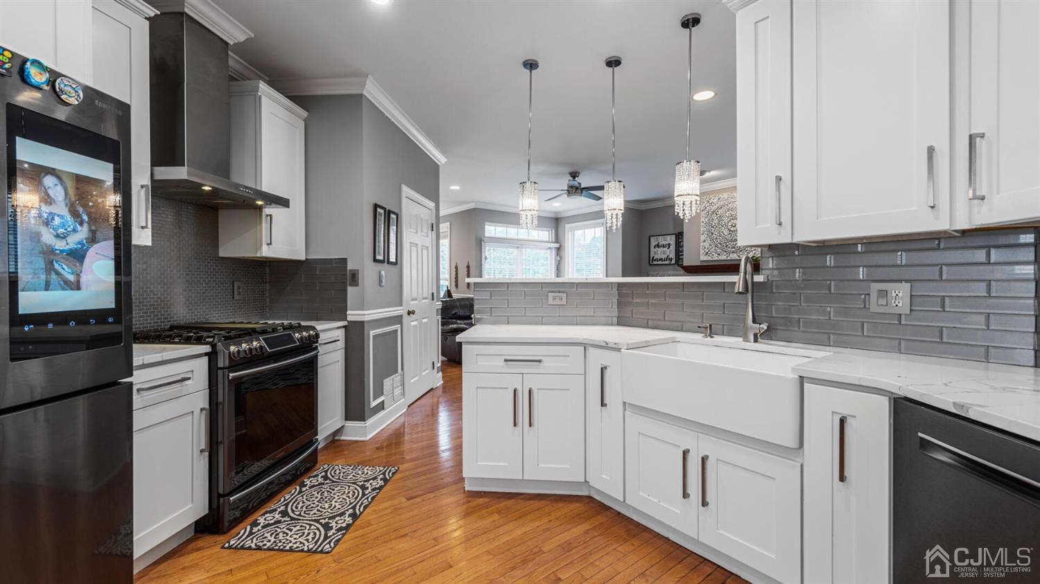 68 Timber Ridge Road North Brunswick, NJ 08902 - Photo 9 of 37 a kitchen with white cabinets and appliances