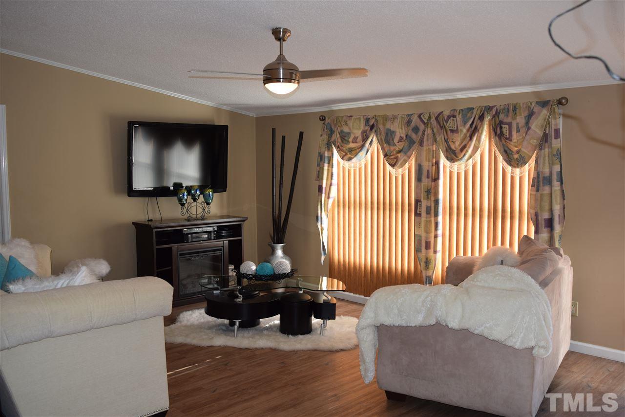 801 Sunshine Road Kenly, NC 27542 - Photo 4 of 24 Blinds are closed here but otherwise, this room has lots of natural morning light!