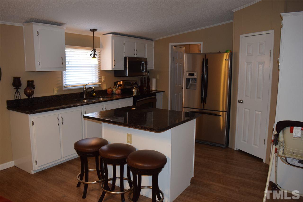 801 Sunshine Road Kenly, NC 27542 - Photo 6 of 24 Low breakfast bar for eating or preparing your meals.