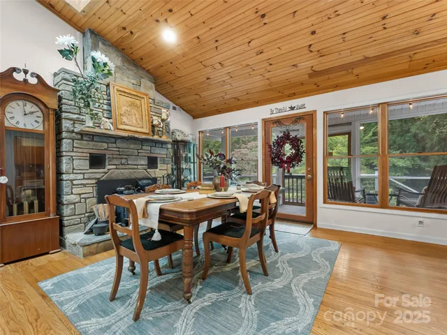a dining room with furniture and wooden floor