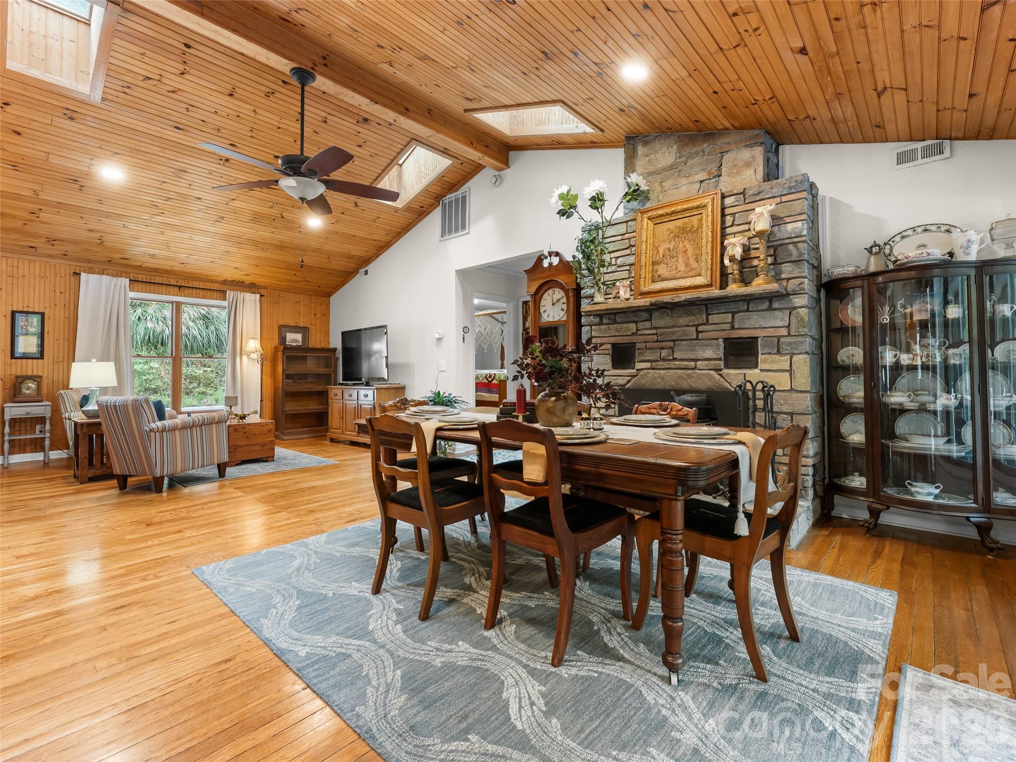 645 West Fork Creek Road Saluda, NC 28773 - Photo 13 of 44 a dining hall with stainless steel appliances granite countertop a table chairs and a view of living room