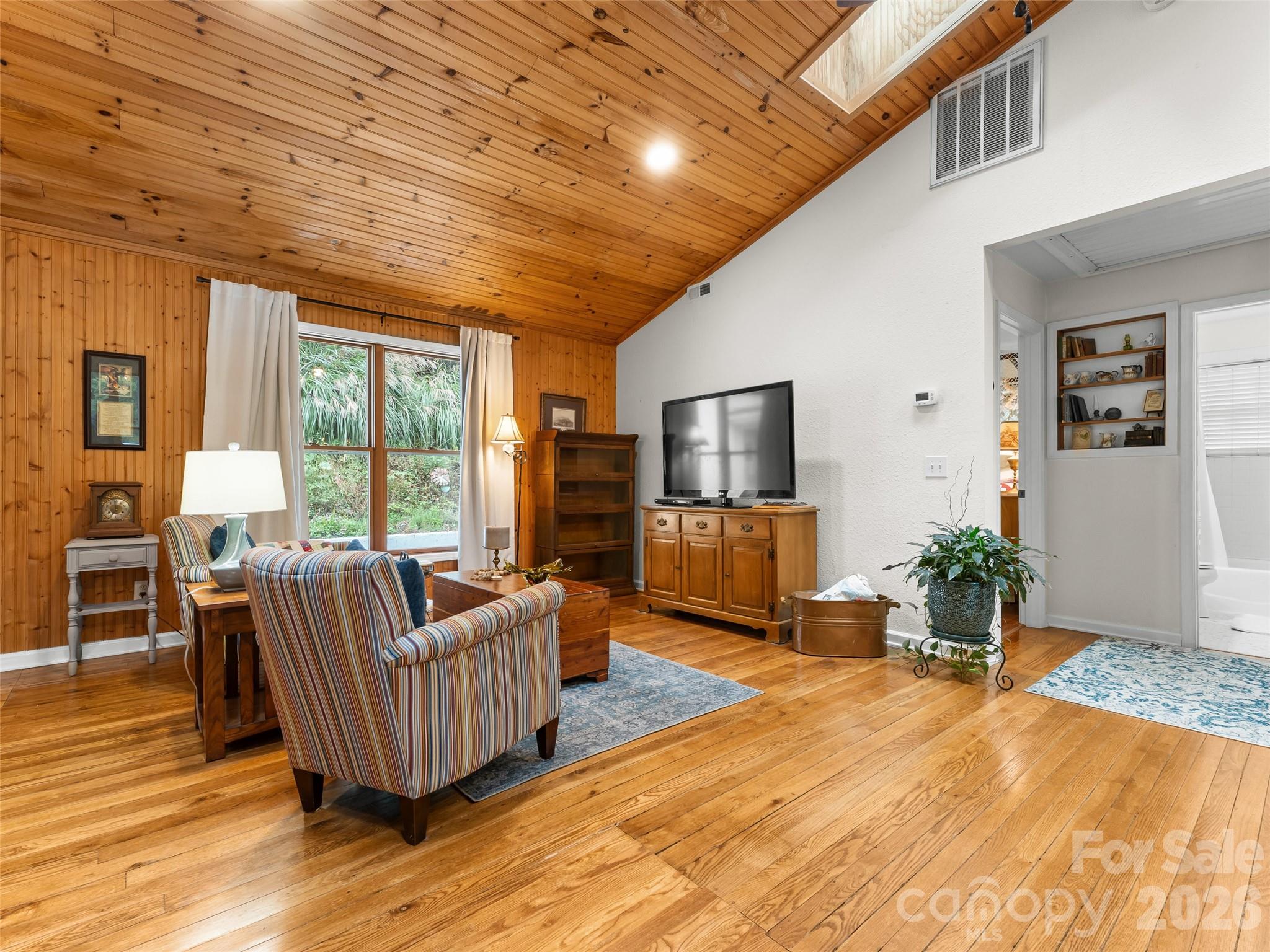 645 West Fork Creek Road Saluda, NC 28773 - Photo 14 of 44 a living room with furniture windows and flat screen tv