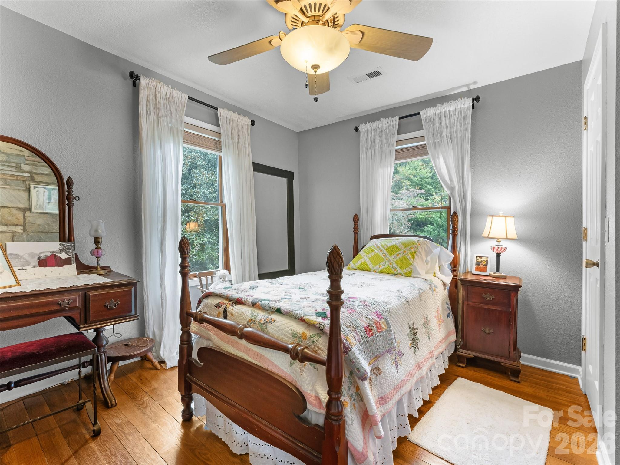 645 West Fork Creek Road Saluda, NC 28773 - Photo 16 of 44 a bedroom with bed and a window