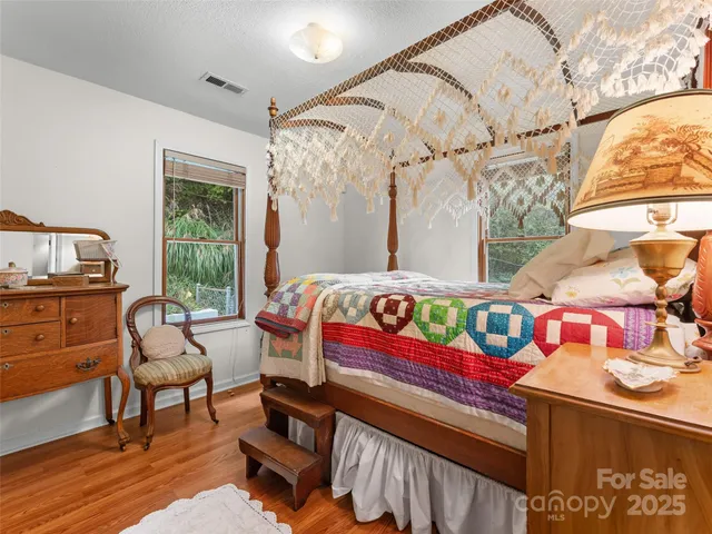 a bedroom with furniture and a window