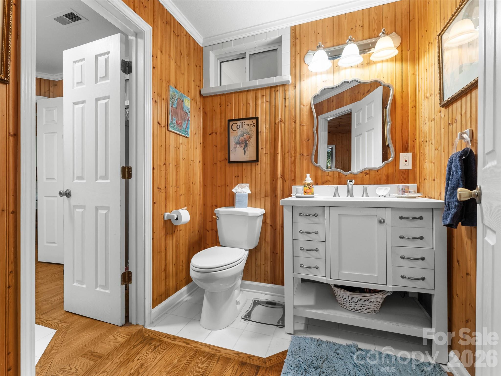 645 West Fork Creek Road Saluda, NC 28773 - Photo 20 of 44 a spacious bathroom with a toilet a sink and a mirror