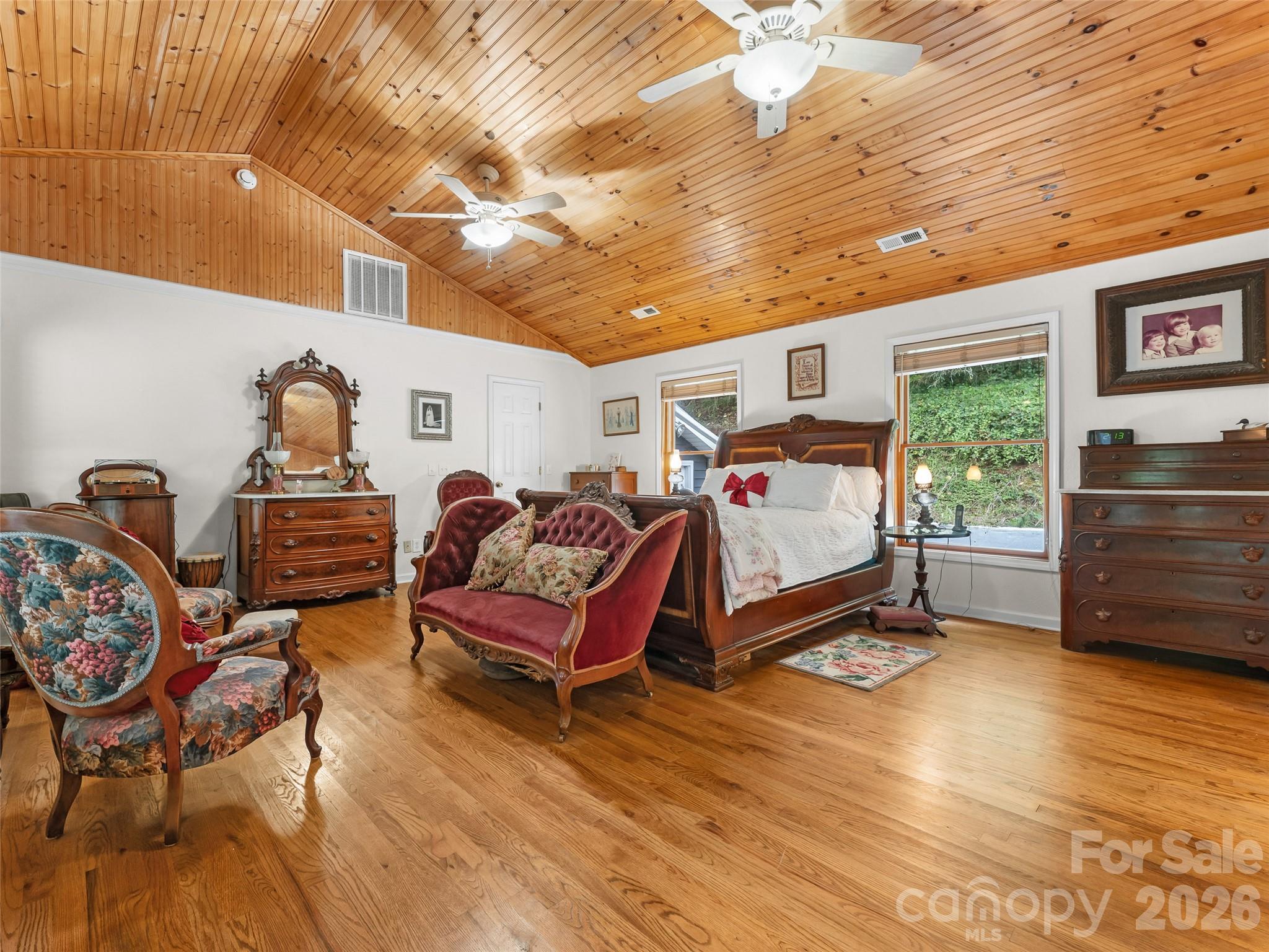 645 West Fork Creek Road Saluda, NC 28773 - Photo 22 of 44 a bedroom with furniture and a wooden floor