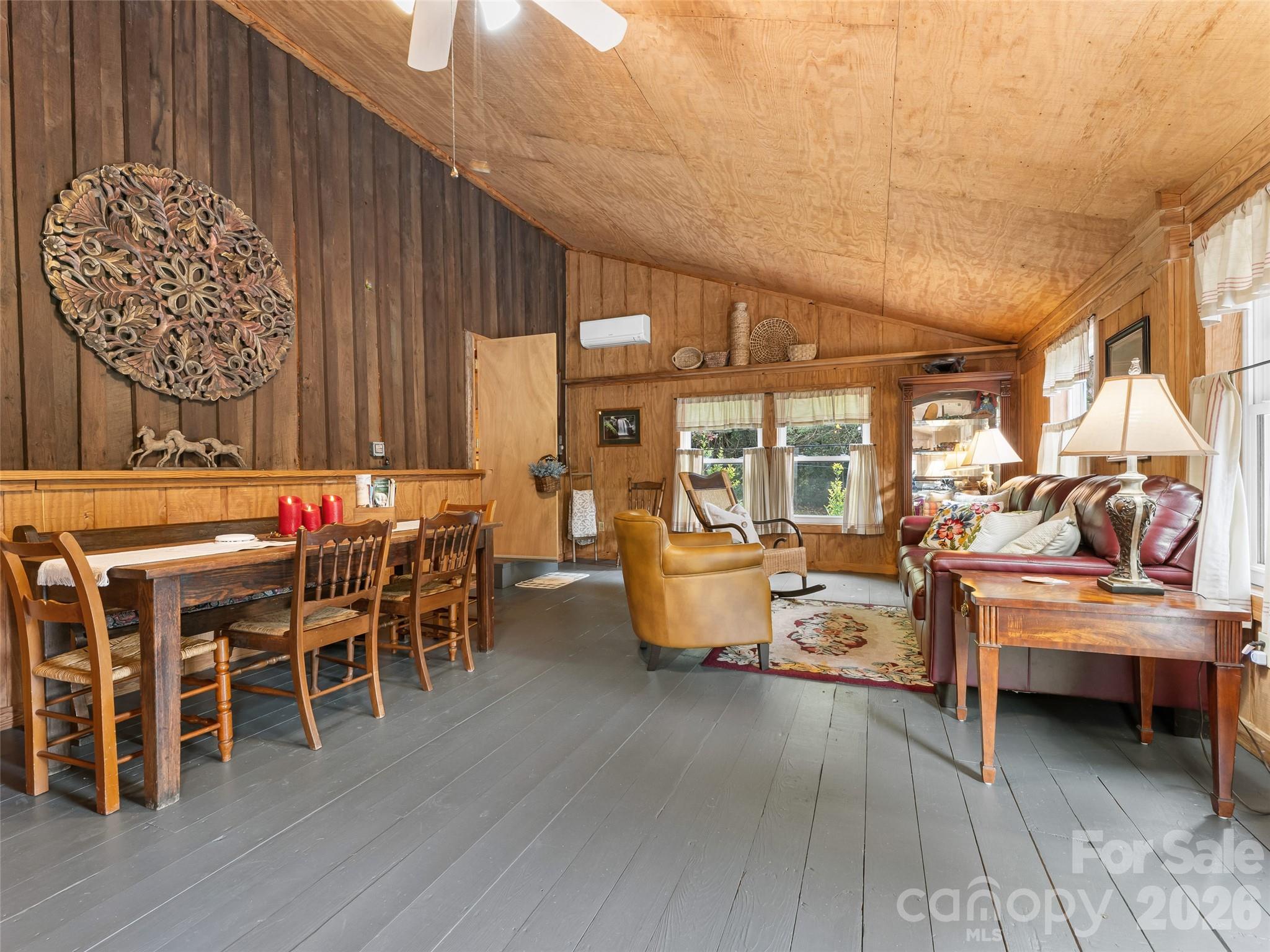 645 West Fork Creek Road Saluda, NC 28773 - Photo 28 of 44 a view of a dining room with furniture window and wooden floor