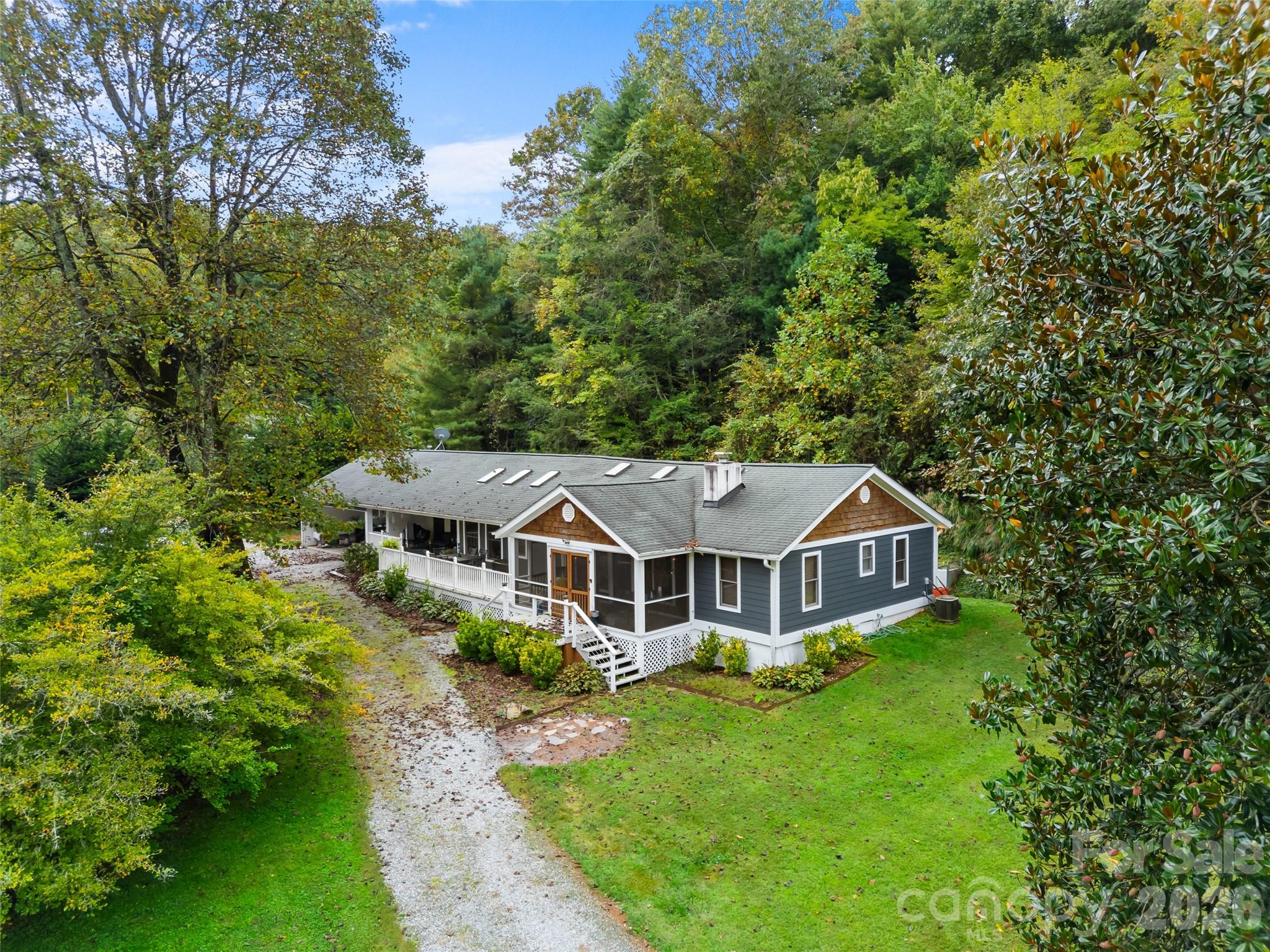 645 West Fork Creek Road Saluda, NC 28773 - Photo 3 of 44 an aerial view of a house with a big yard