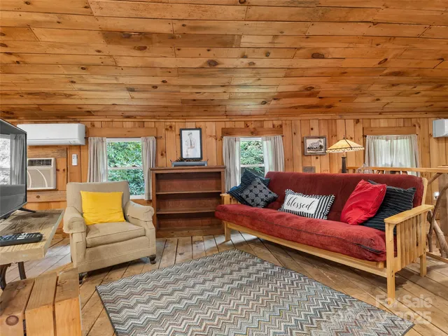 a bedroom with double bed and a night stand