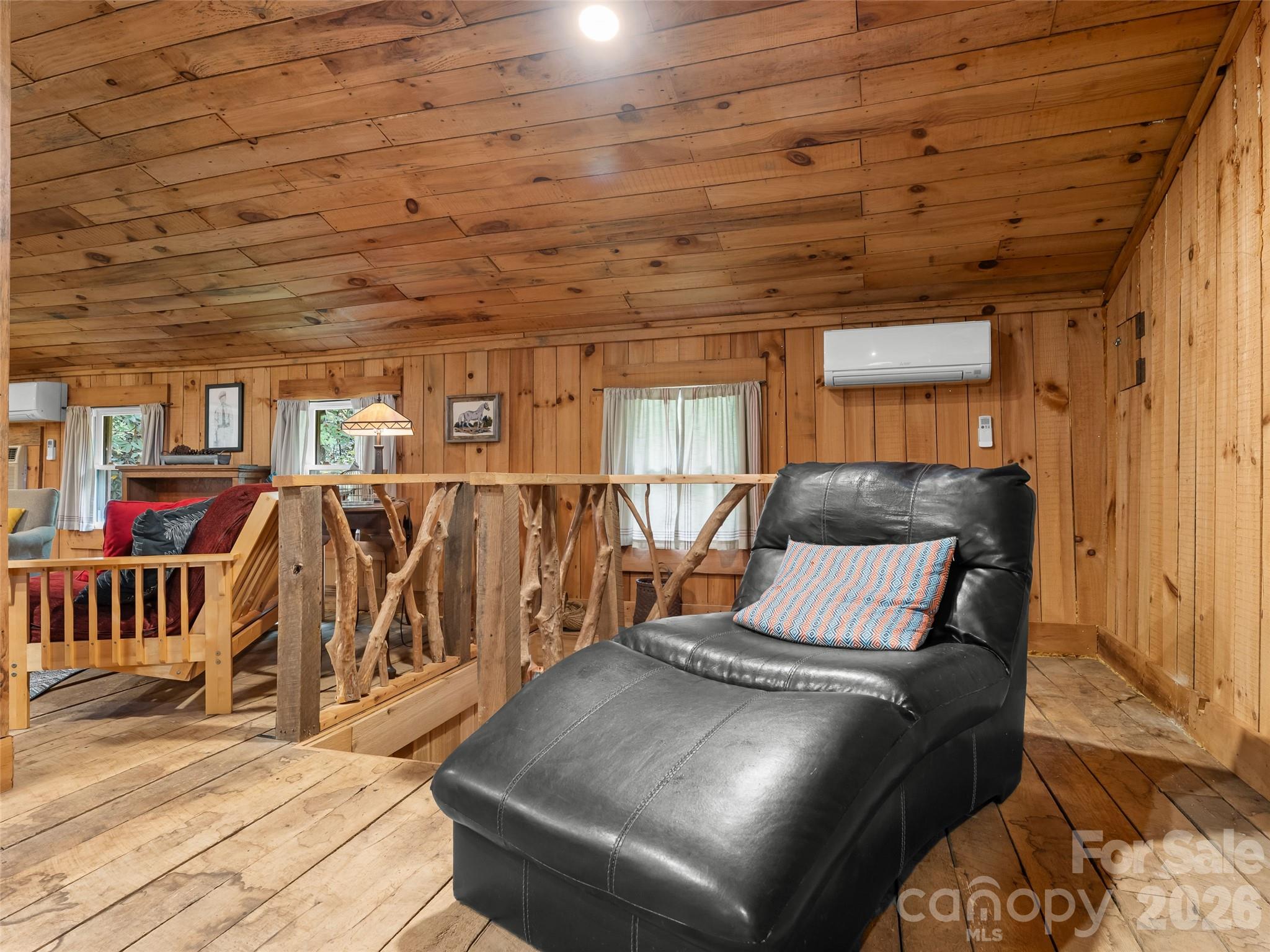 645 West Fork Creek Road Saluda, NC 28773 - Photo 37 of 44 a bedroom with furniture and wooden floor